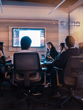 An agency team in a project review meeting