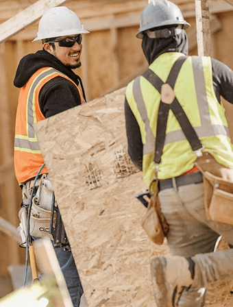 Contractors working together on a build site